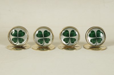 Lot 344 - A CASED SET OF FOUR SILVER AND MOTHER OF PEARL SHAMROCK MENU HOLDERS