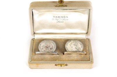 Lot 429 - A CASED SET OF TWO HERMES SILVER COIN MENU HOLDERS