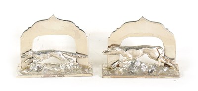 Lot 463 - A PAIR OF SILVER MENU HOLDERS MODELLED AS FOX AND HOUND