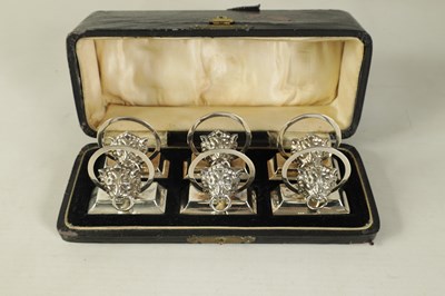 Lot 458 - A CASED SET OF SIX LION MASK DOOR KNOCKER SILVER MENU HOLDERS