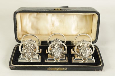 Lot 458 - A CASED SET OF SIX LION MASK DOOR KNOCKER SILVER MENU HOLDERS