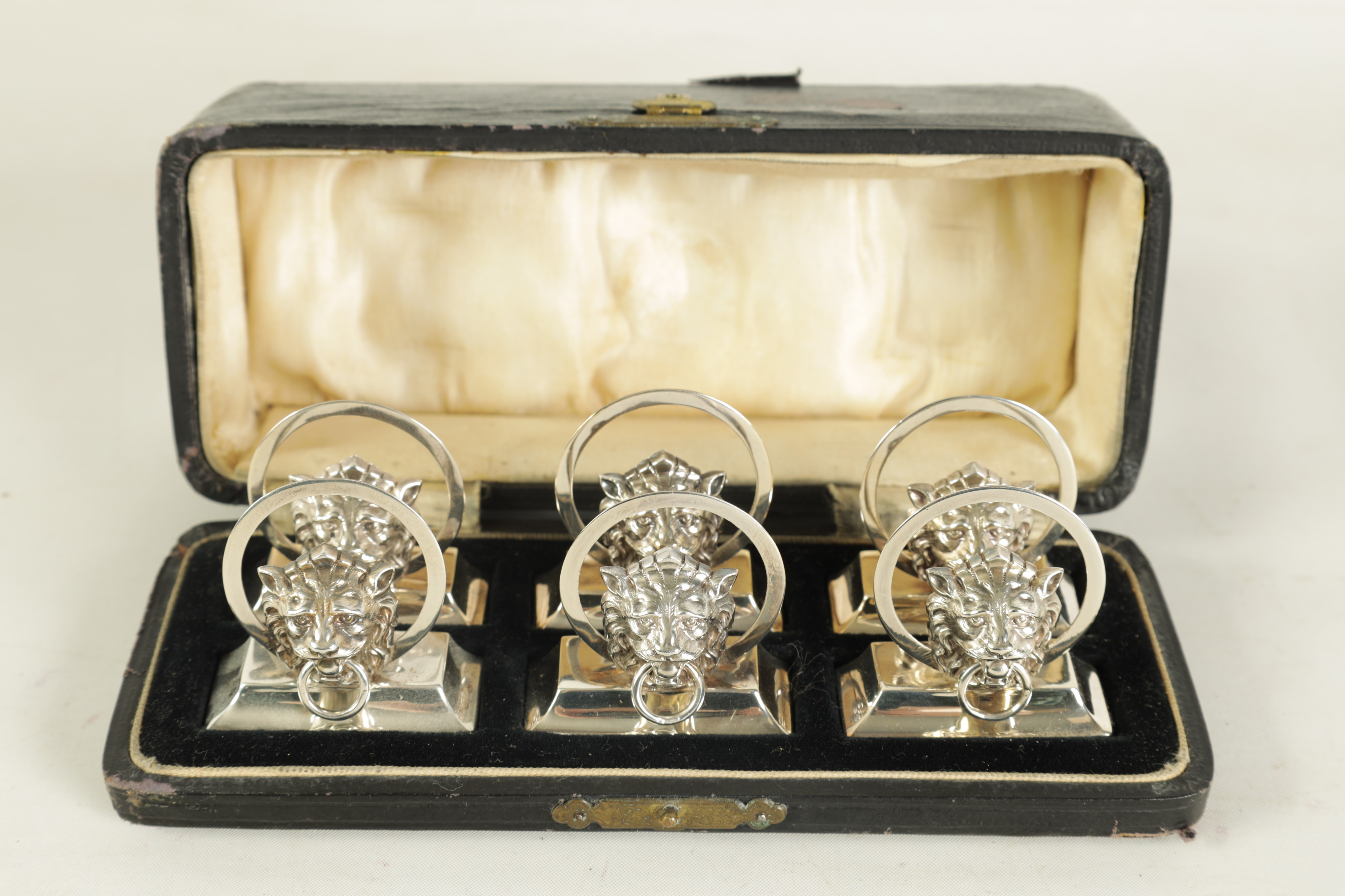 Lot 458 - A CASED SET OF SIX LION MASK DOOR KNOCKER
