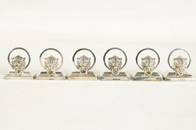 Lot 458 - A CASED SET OF SIX LION MASK DOOR KNOCKER SILVER MENU HOLDERS