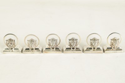 Lot 458 - A CASED SET OF SIX LION MASK DOOR KNOCKER SILVER MENU HOLDERS