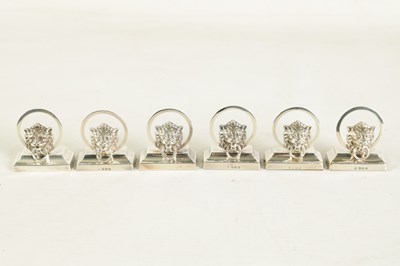 Lot 458 - A CASED SET OF SIX LION MASK DOOR KNOCKER SILVER MENU HOLDERS