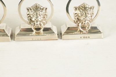 Lot 458 - A CASED SET OF SIX LION MASK DOOR KNOCKER SILVER MENU HOLDERS