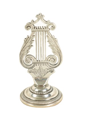 Lot 413 - A LATE 19TH CENTURY SILVER LYRE MENU HOLDER