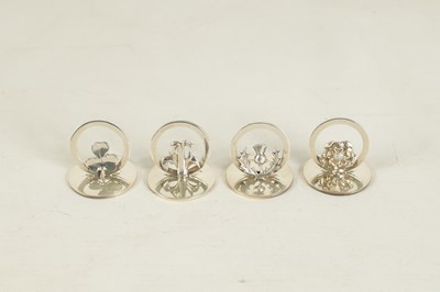 Lot 322 - A CASED SET OF FOUR SILVER SYMBOLIC MENU HOLDERS