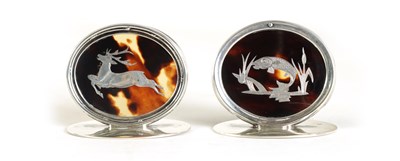 Lot 378 - A MATCHED PAIR OF SILVER AND TORTOISESHELL STAG AND SALMON MENU HOLDERS