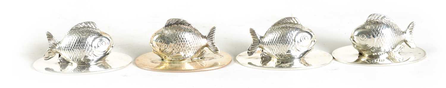 Lot 348 - A SET OF FOUR SILVER FISH MENU HOLDERS