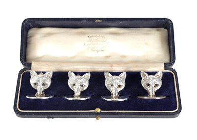 Lot 346 - A CASED SET OF FOUR FOX HEAD SILVER MENU HOLDERS