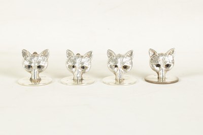 Lot 346 - A CASED SET OF FOUR FOX HEAD SILVER MENU HOLDERS