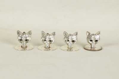 Lot 346 - A CASED SET OF FOUR FOX HEAD SILVER MENU HOLDERS