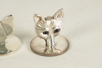 Lot 346 - A CASED SET OF FOUR FOX HEAD SILVER MENU HOLDERS