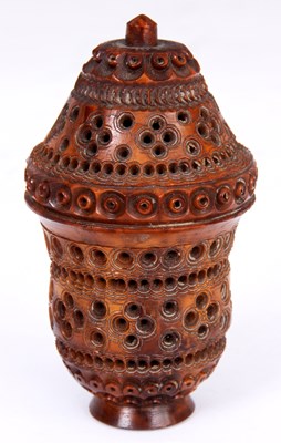 Lot 108 - A 19TH CENTURY CARVED COQUILLA NUT SPICE...