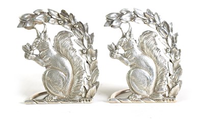 Lot 464 - A PAIR OF LATE 19TH CENTURY SILVER SQUIRREL MENU HOLDERS