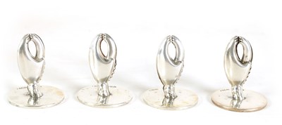 Lot 474 - A SET OF FOUR SILVER CRAB CLAW MENU HOLDERS