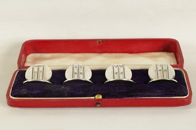 Lot 466 - A CASED SET OF FOUR SILVER CRICKET MENU HOLDERS