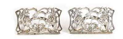 Lot 405 - A  PAIR OF SILVER FLORAL MENU HOLDERS