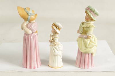 Lot 42 - TOWN GIRL AND COUNTRY GIRL. THREE ROYAL WORCESTER CANDLE EXTINGUISHERS