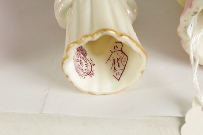 Lot 42 - TOWN GIRL AND COUNTRY GIRL. THREE ROYAL WORCESTER CANDLE EXTINGUISHERS