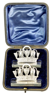 Lot 359 - A CASED PAIR OF ROYAL NAVY CROWNS CAST SILVER MENU HOLDERS