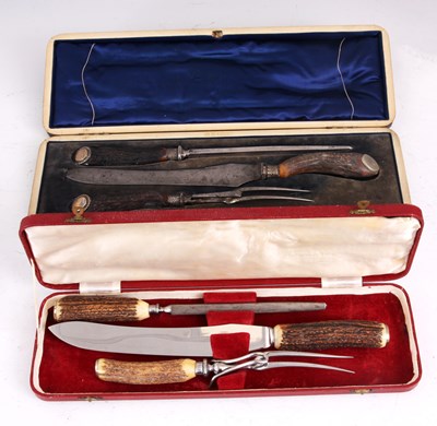 Lot 125 - A CASED STAG HORN CARVING SET retailed by...