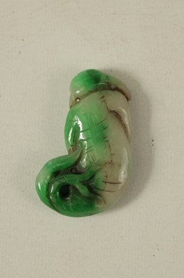 Lot 134 - A CHINESE TWO TONE CARVED JADE SCULPTURE