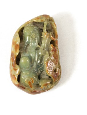 Lot 102 - A CHINESE RUSSET JADE CARVED AND PIERCED SCULPTURE