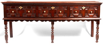 Lot 669 - A 17th Century joined Oak moulded front low...