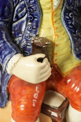 Lot 79 - A 19TH CENTURY STAFFORDSHIRE ‘ENGLISH SQUIRE’ TOBY JUG AND ANOTHER ‘HEARTY GOOD FELLOW’ TOBY JUG