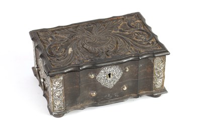 Lot 159 - AN 18TH CENTURY CEYLONESE CARVED EBONY AND SILVER METAL MOUNTED JEWELLERY BOX