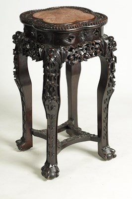 Lot 139 - A 19TH CENTURY CHINESE PROFUSELY CARVED HARDWOOD JARDINIERE STAND