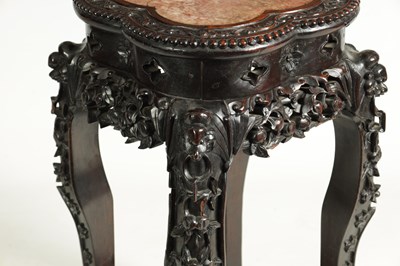 Lot 139 - A 19TH CENTURY CHINESE PROFUSELY CARVED HARDWOOD JARDINIERE STAND