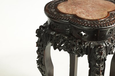 Lot 139 - A 19TH CENTURY CHINESE PROFUSELY CARVED HARDWOOD JARDINIERE STAND