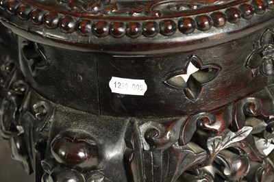 Lot 139 - A 19TH CENTURY CHINESE PROFUSELY CARVED HARDWOOD JARDINIERE STAND