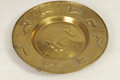 Lot 425 - A 17TH CENTURY NURMBERG BRASS ‘ADAM AND EVE’ CHARGER OF LARGE SIZE