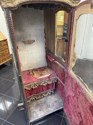 Lot 103 - AN EARLY/MID18TH CENTURY CARVED GILT-WOOD AND STUDDED LEATHER SEDAN CHAIR