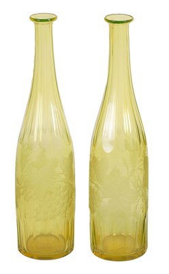 Lot 21 - A PAIR OF BOHEMIAN PALE AMBER WINE BOTTLES