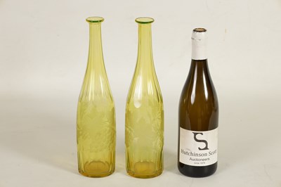 Lot 21 - A PAIR OF BOHEMIAN PALE AMBER WINE BOTTLES