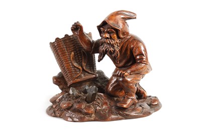 Lot 861 - A LATE 19TH CENTURY CARVED BLACK FOREST GNOME DESK TIDY