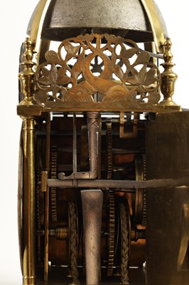 Lot 772 - THOMAS KNIFTON, AT THE CROSS KEYS IN LOTHBURY, LONDINI. A FINE CHARLES II BALANCE WHEEL VERGE LANTERN CLOCK