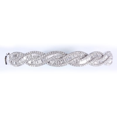 Lot 190 - AN 18ct WHITE GOLD BAGUETTE AND BRILLIANT CUT...