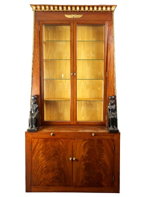 Lot 939 - AN UNUSUAL REGENCY MAHOGANY AND GILT BRASS MOUNTED DISPLAY CABINET WITH BOOKCASE IN THE EGYPTIAN TASTE