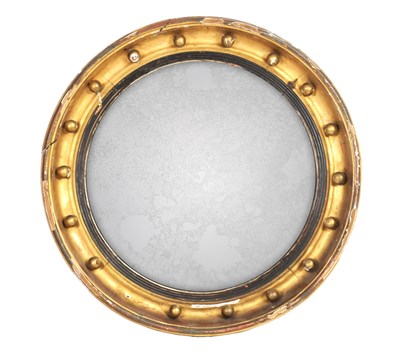 Lot 1080 - A REGENCY GILTWOOD CONVEX CIRCULAR MIRROR