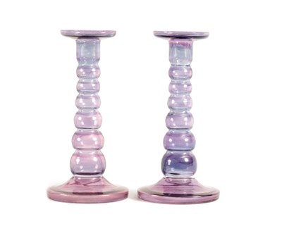 Lot 8 - A PAIR OF EARLY 20TH CENTURY IRIDESCENT AUBERGINE GLASS CANDLESTICKS