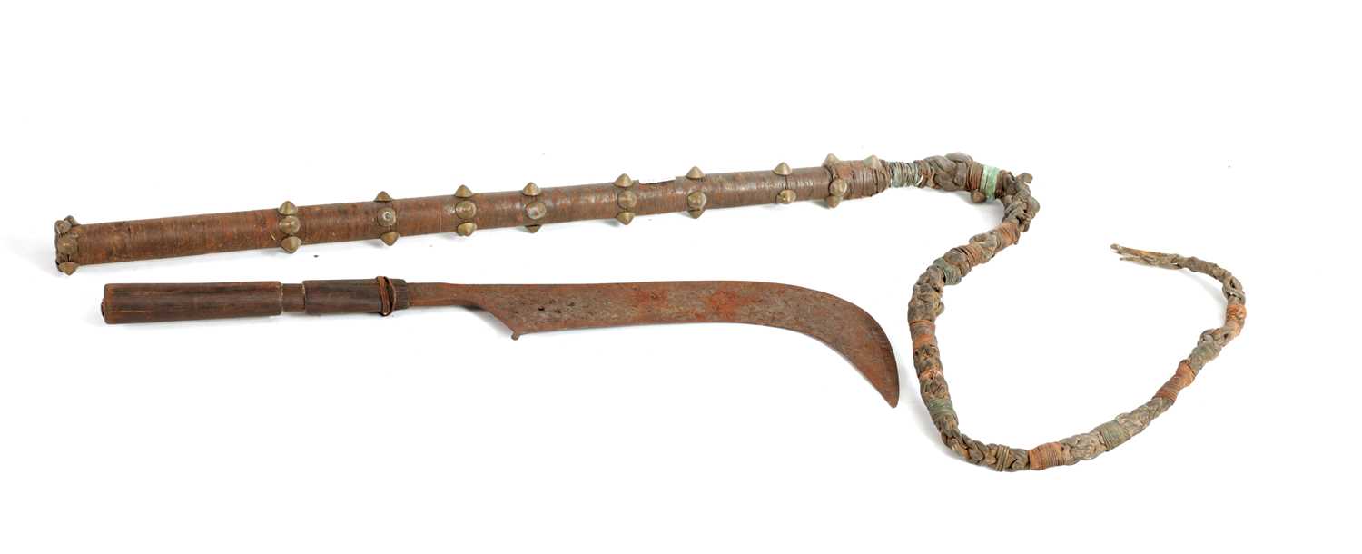 Lot 384 - A 19TH CENTURY AFRICAN SCYTHE AND WHIP