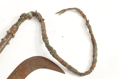 Lot 384 - A 19TH CENTURY AFRICAN SCYTHE AND WHIP