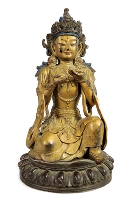 Lot 164 - AN EARLY GILT BRONZE TIBETAN BUDDHA