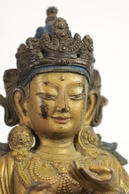 Lot 164 - AN EARLY GILT BRONZE TIBETAN BUDDHA